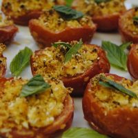 Stuff roasted tomatoes with feta cheese and mint herb. Great appetizer or side dish for any occasion. #StuffedTomatoes #StuffedRoastedTomatoes #HerbStuffedTomatoes