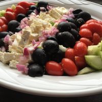 hardy Greek salad with tomatoes, feta, black olives