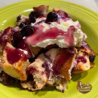 RAM-Overnight French Toast Casserole With Blueberries serving on chartreuse green bowl
